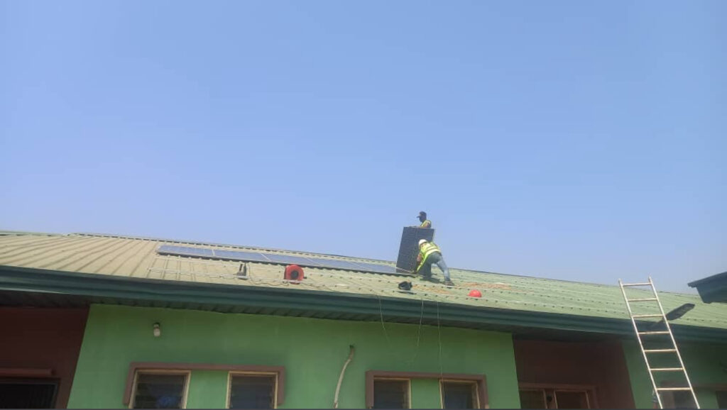 Solar installer installing solar panels